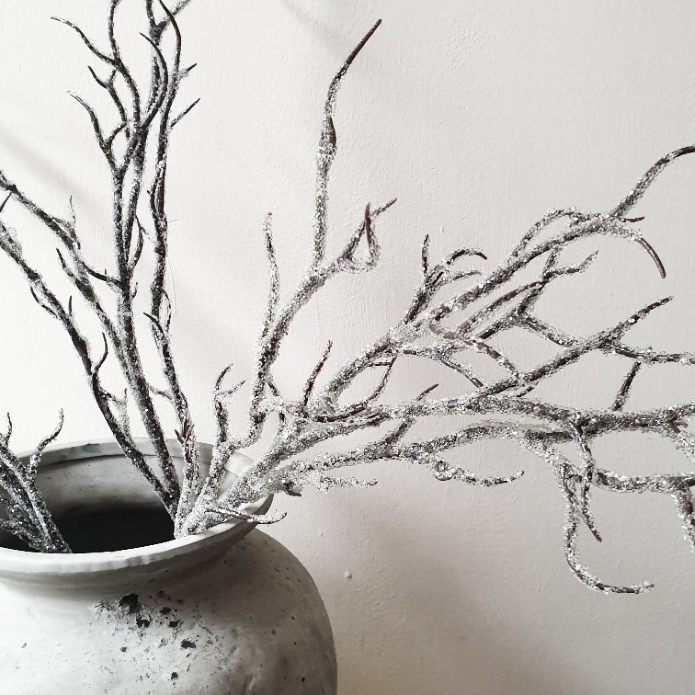 wedding flowers Cheshire - Decorative branches in a pot on a light background