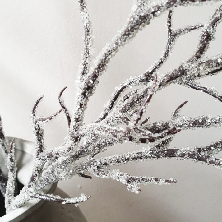 wedding flowers Cheshire - Decorative branches with glitter on a white background
