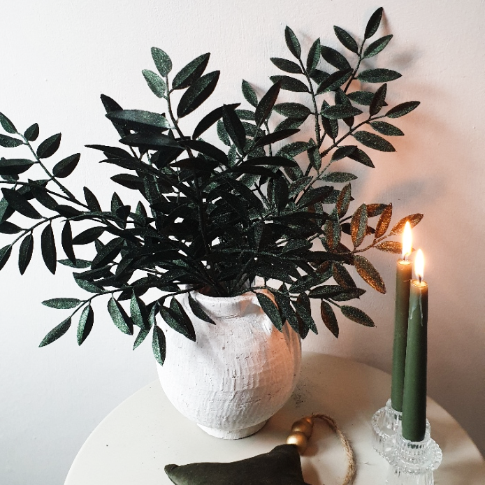 wedding flowers Cheshire - Potted plant on a table with two lit candles