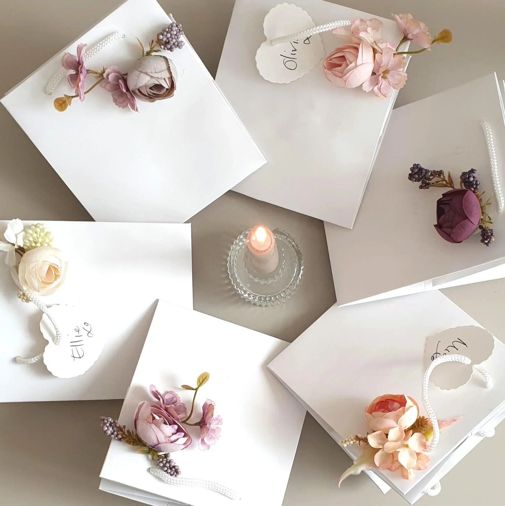 wedding flowers Cheshire - White greeting cards with floral designs on a neutral background